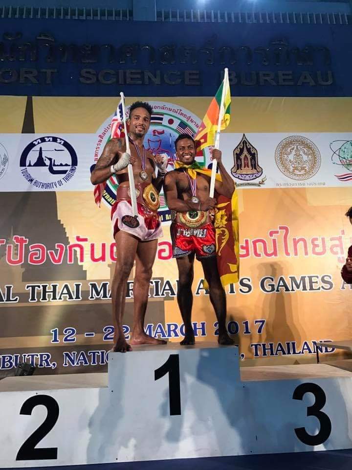 Nilanka Madushan on the winner's podium with the Sri Lankan flag, Thailand 2017