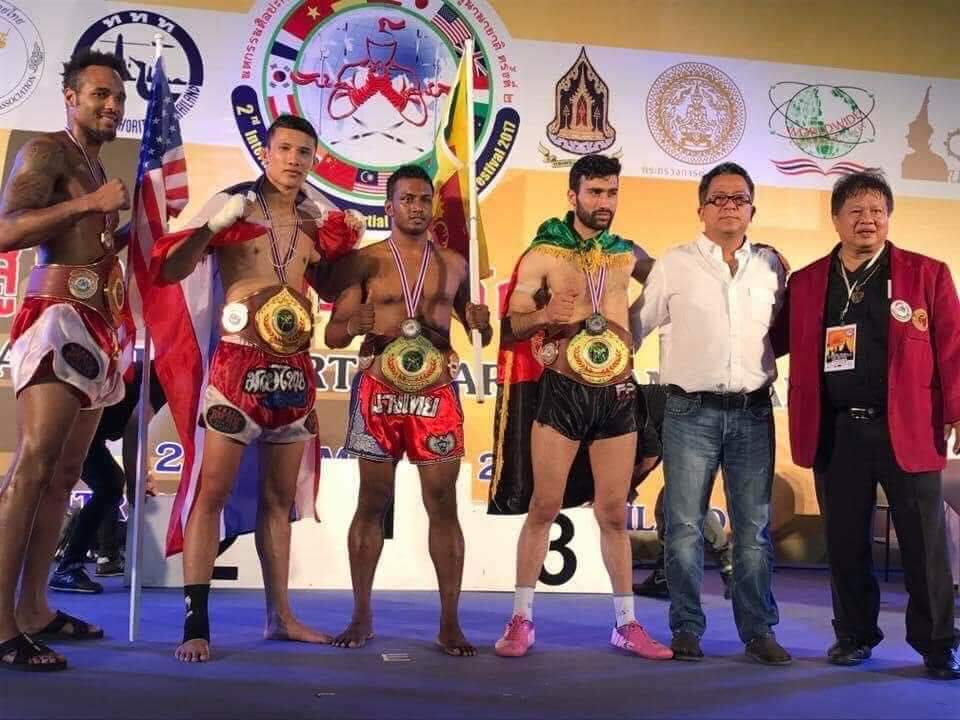 Champions lined up with belts and flags